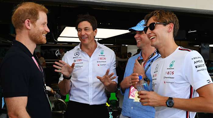 Prince Harry, talks with Toto Wolff, Team Principal and CEO of Mercedes-AMG, and driver George Russell at the U.S. Grand Prix.